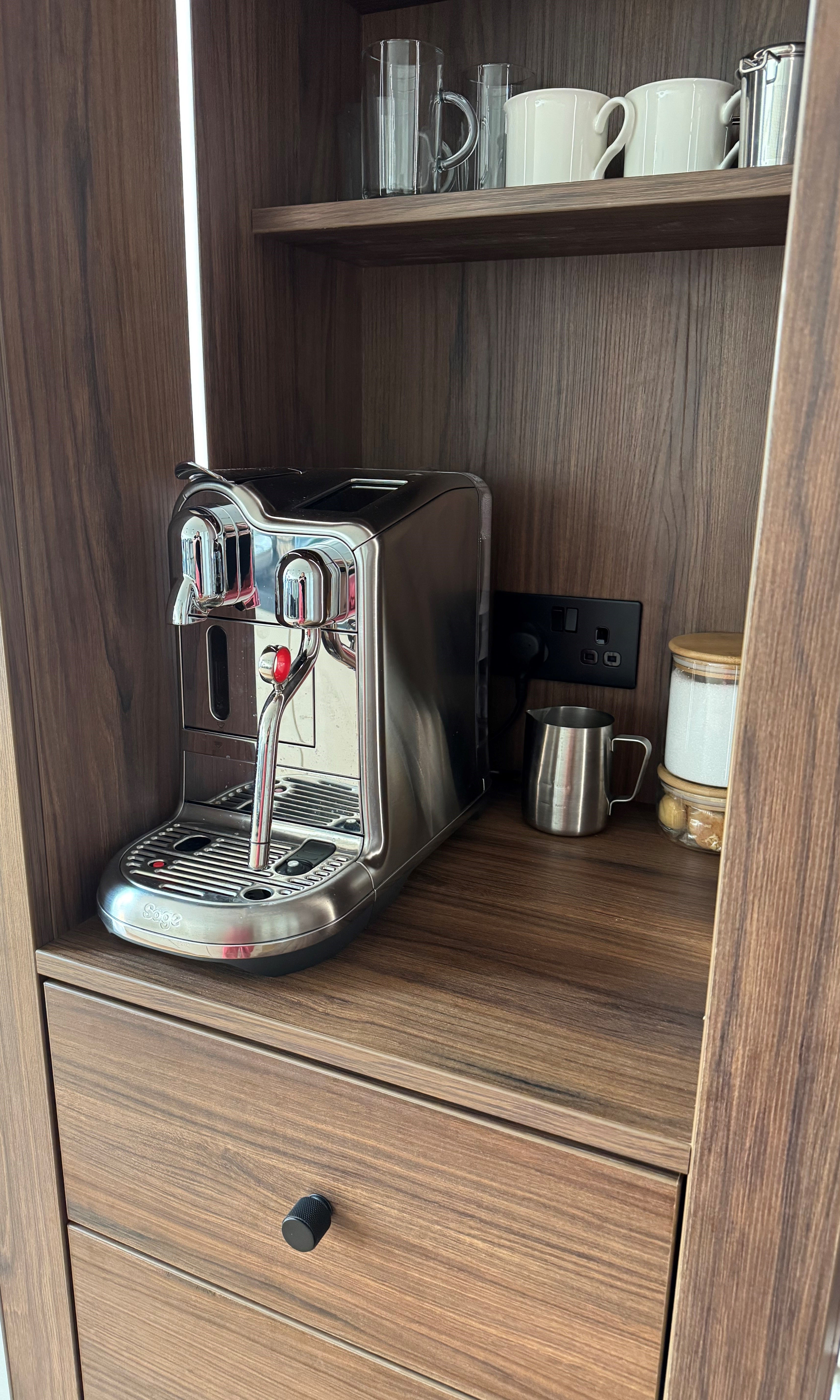 Close up of Portofino Coffee Bar in Walnut Showcasing the Nespresso Creative Pro