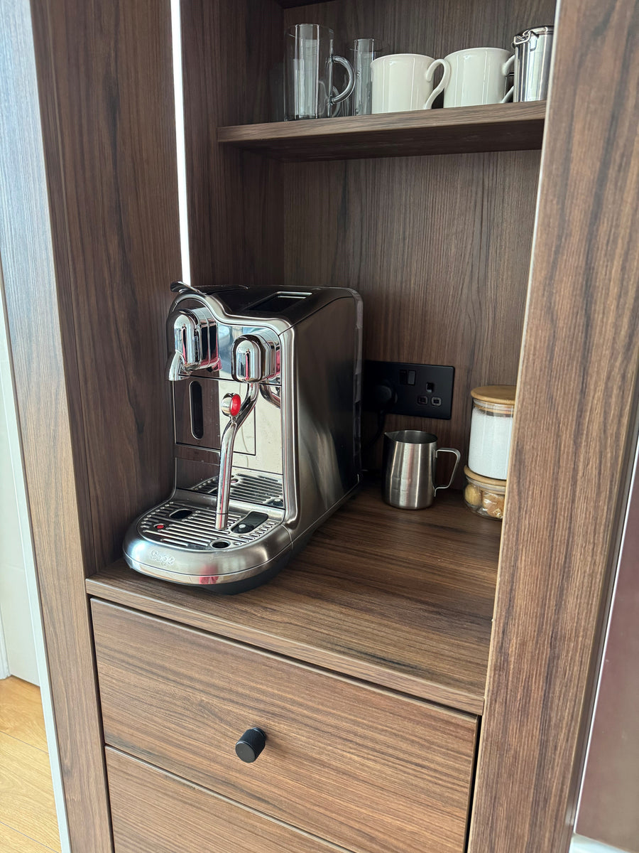 Close up of Portofino Coffee Bar in Walnut Showcasing the Nespresso Creative Pro